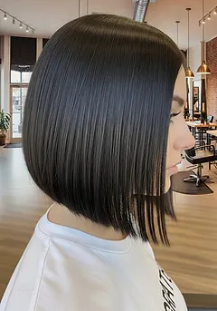 A sharp blunt chin-length bob with a razor-clean baseline